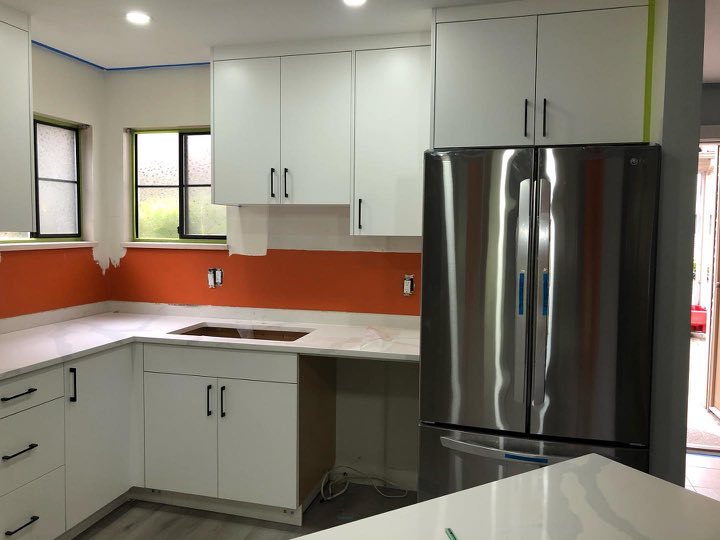 White Kitchen with Orange Backsplash